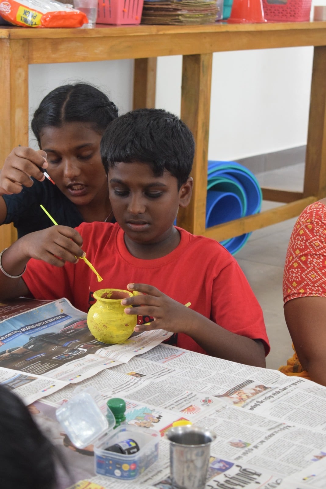 Child painting at Visvatha Learning Centre
